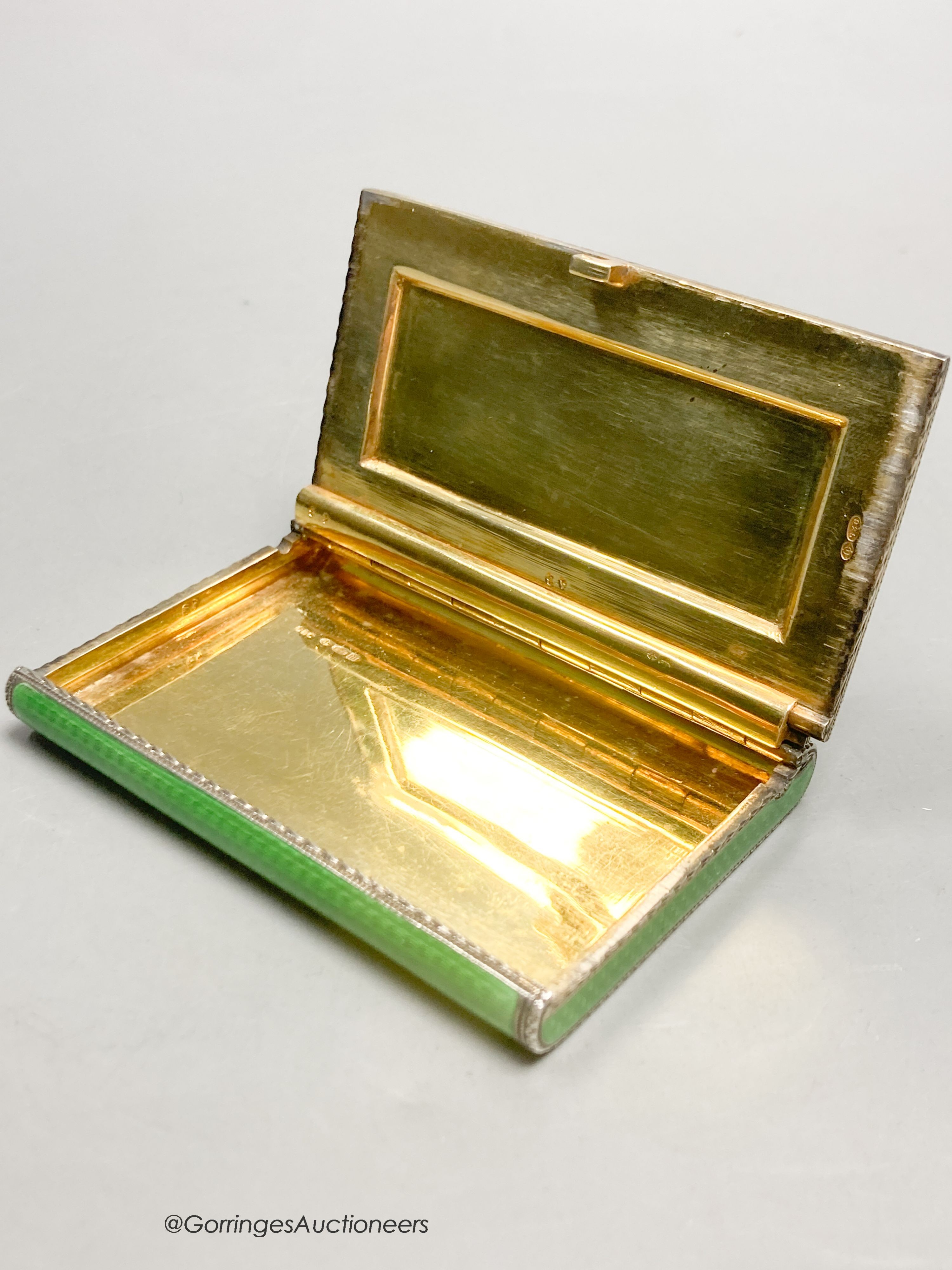 A 1920's continental silver and green guilloche enamel rectangular box and hinged cover, import marks for Cohen & Charles, London, 1927, 79mm by 54mm by 10mm
